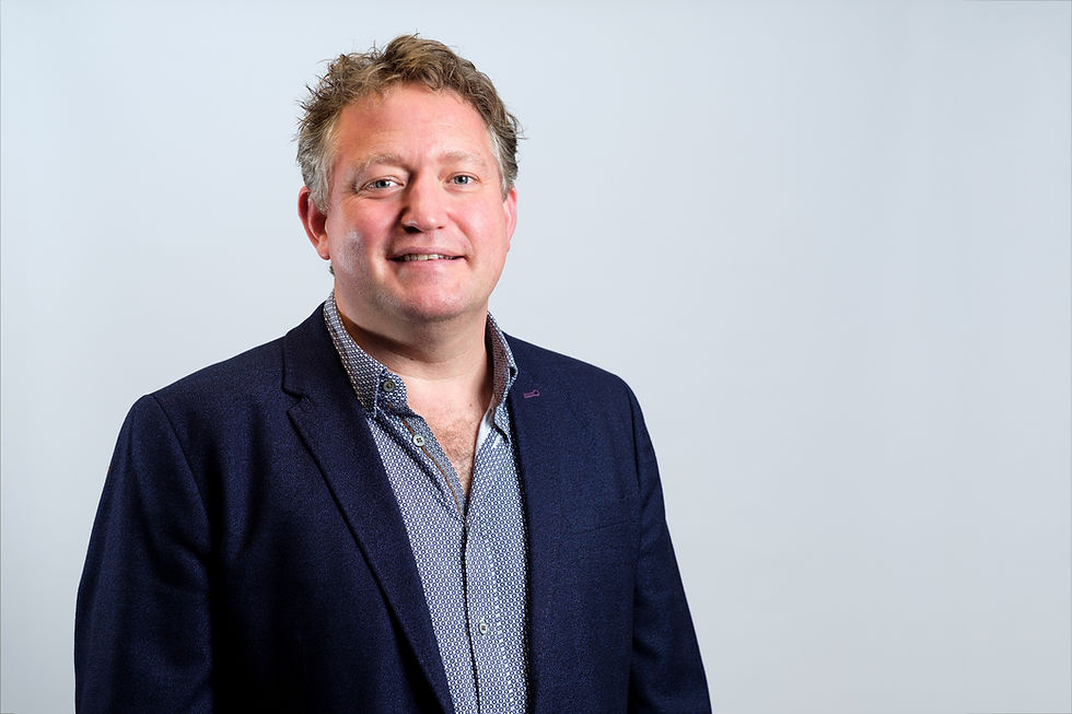 a man in a button up shirt and jacket