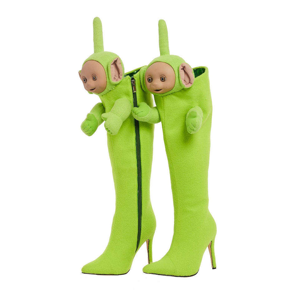 An image of a bright green pair of heeled boots with the torso of a green smiling alien at the top.
