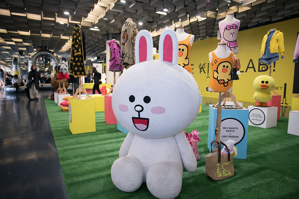 exhibit stand featuring clothing and big toys with cartoon characters