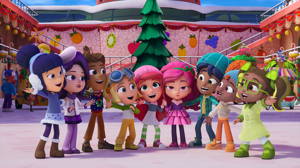 A group of fruit-themed CG-animated cartoon characters stand smiling in a huddle dressed in winter attire.
