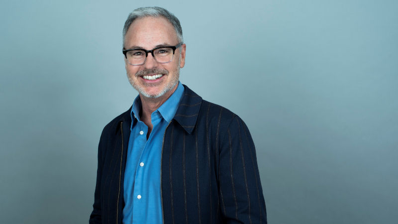 a portrait of a man in glasses