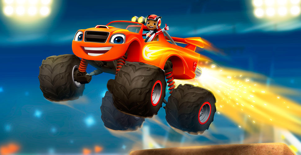 A smiling, red ATV flying though the air. There is a boy sitting in the vehicle smiling and holding his thumbs up.