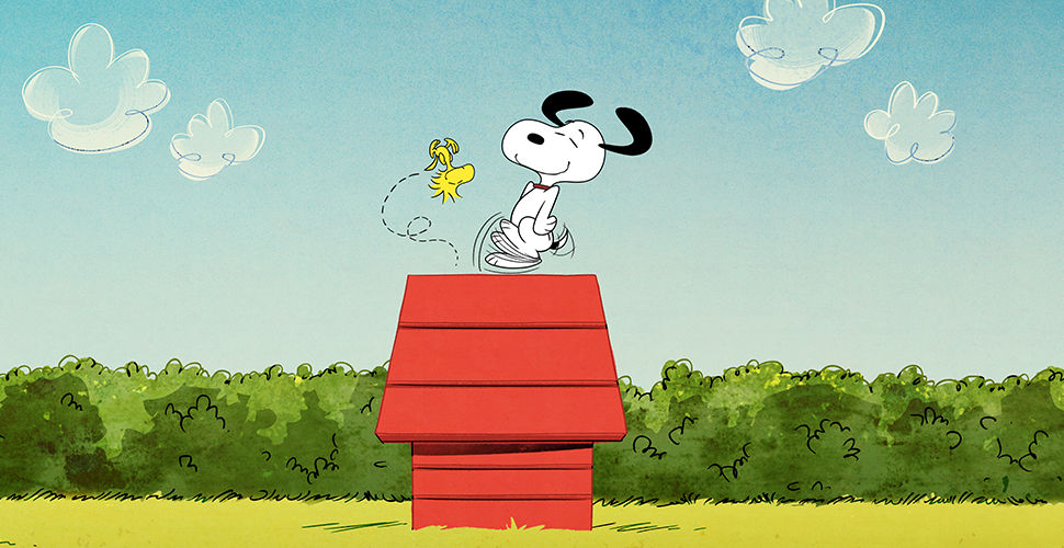 Peanuts show character Snoopy jumping on a red dog house with a yellow bird