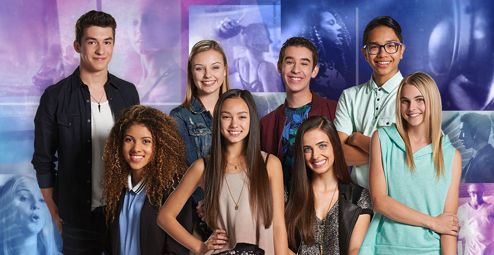 group of students in front of a colourful background