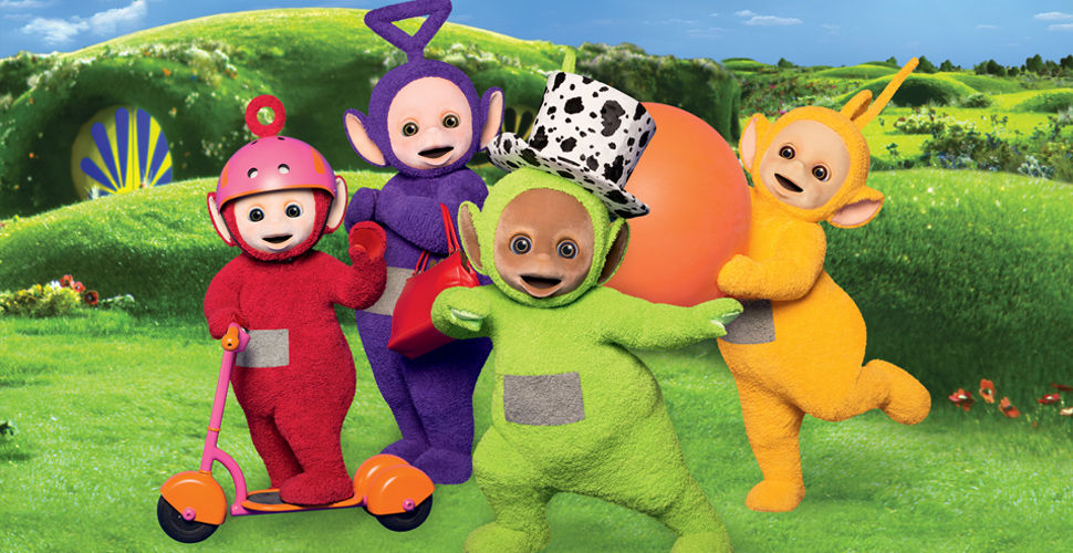 four colourful characters on a hillside. one is riding a scooter and one is wearing a top hat