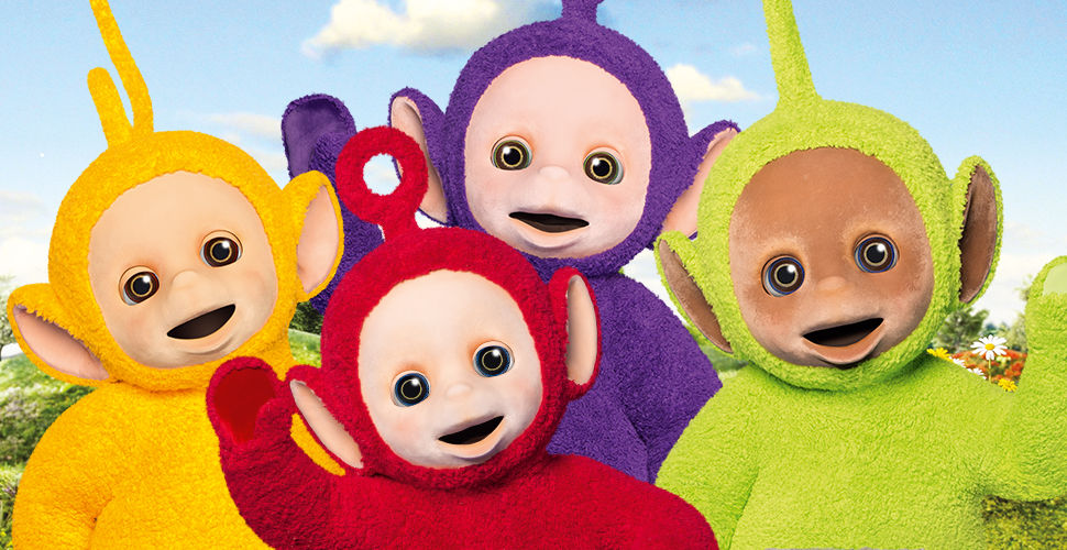 four fuzzy characters wave from a hillside