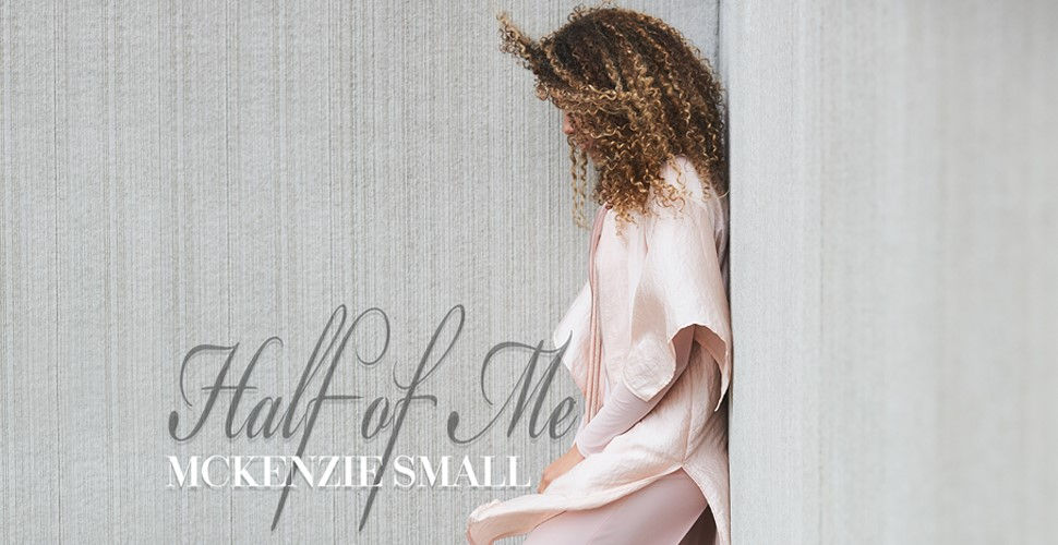 profile of a young woman leaning on the wall