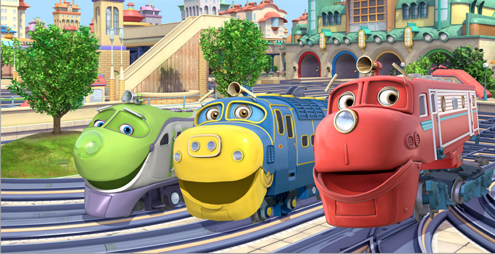 3 smiling trains in a trainyard