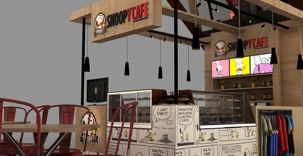 a Snoopy branded café with wooden walls and Snoopy comic panels on the coffee bar