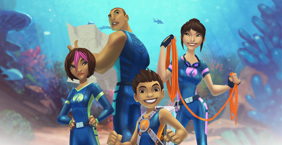 mother, father, daughter, son wearing blue wetsuits exploring underwater