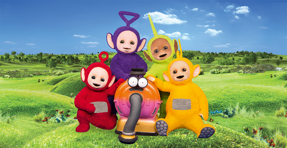 4 fuzzy characters and a vacuum on a hill