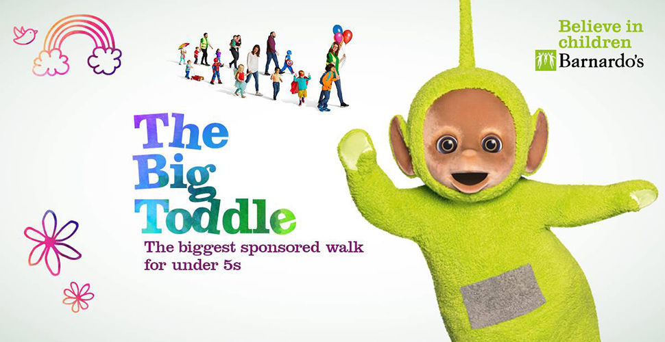 fuzzy green character waving and people walking. text "The Big Toddle, the biggest sponsored walk for under 5s." Barnardo's logo